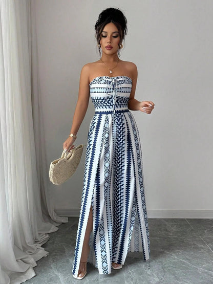 👗💙 אוברול גיאומטרי עם מחשוף הלטר וחתך בצד – 50% הנחה! מושלם לחוף, למשרד ולערב. 🔥✨